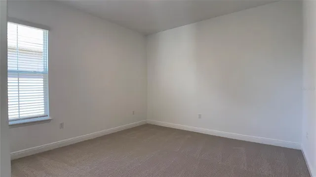 an empty room with a bathroom
