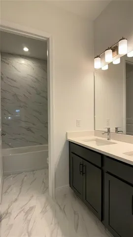 a bathroom with a toilet and a bathtub