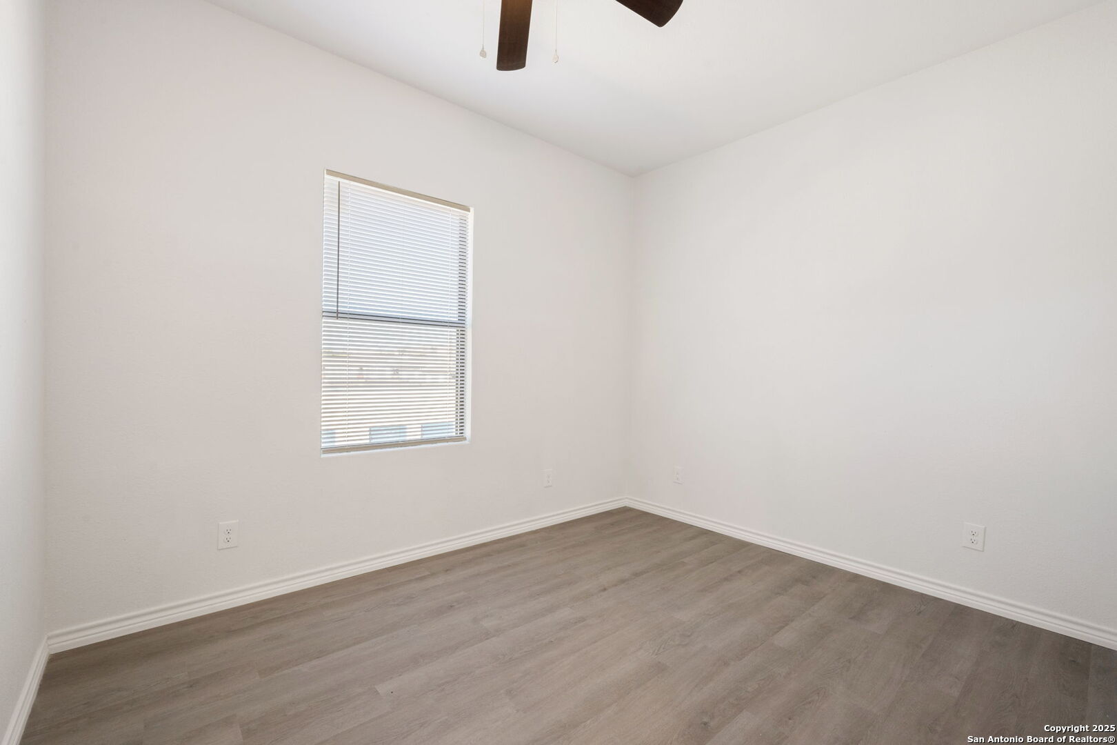 8719 Wurzbach Road, Unit 102 San Antonio, TX 78240 - Photo 11 of 18 an empty room with a window