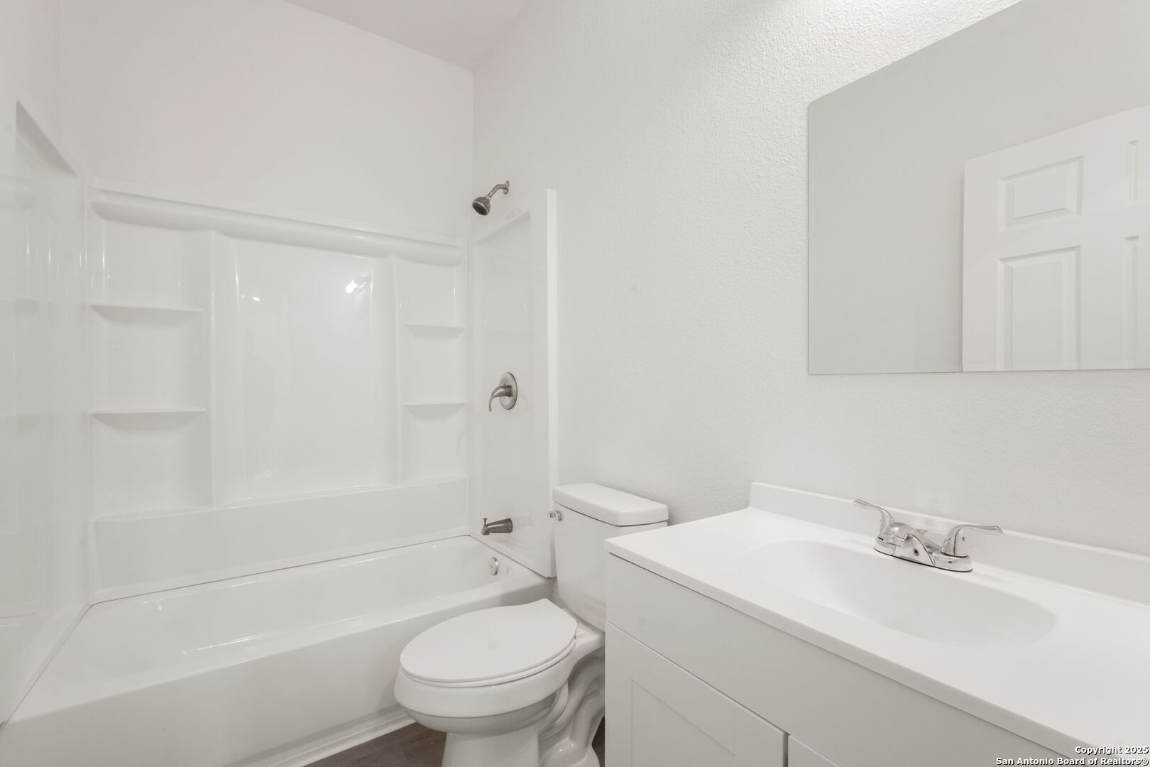 8719 Wurzbach Road, Unit 102 San Antonio, TX 78240 - Photo 12 of 18 a bathroom with a sink a toilet and shower