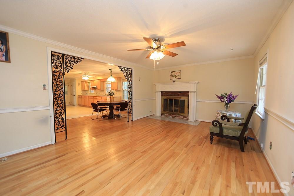 1603 Westhaven Drive Raleigh, NC 27607 - Photo 8 of 30 a living room with furniture and a fireplace