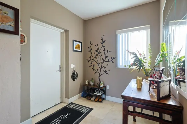 a room with furniture and a potted plant