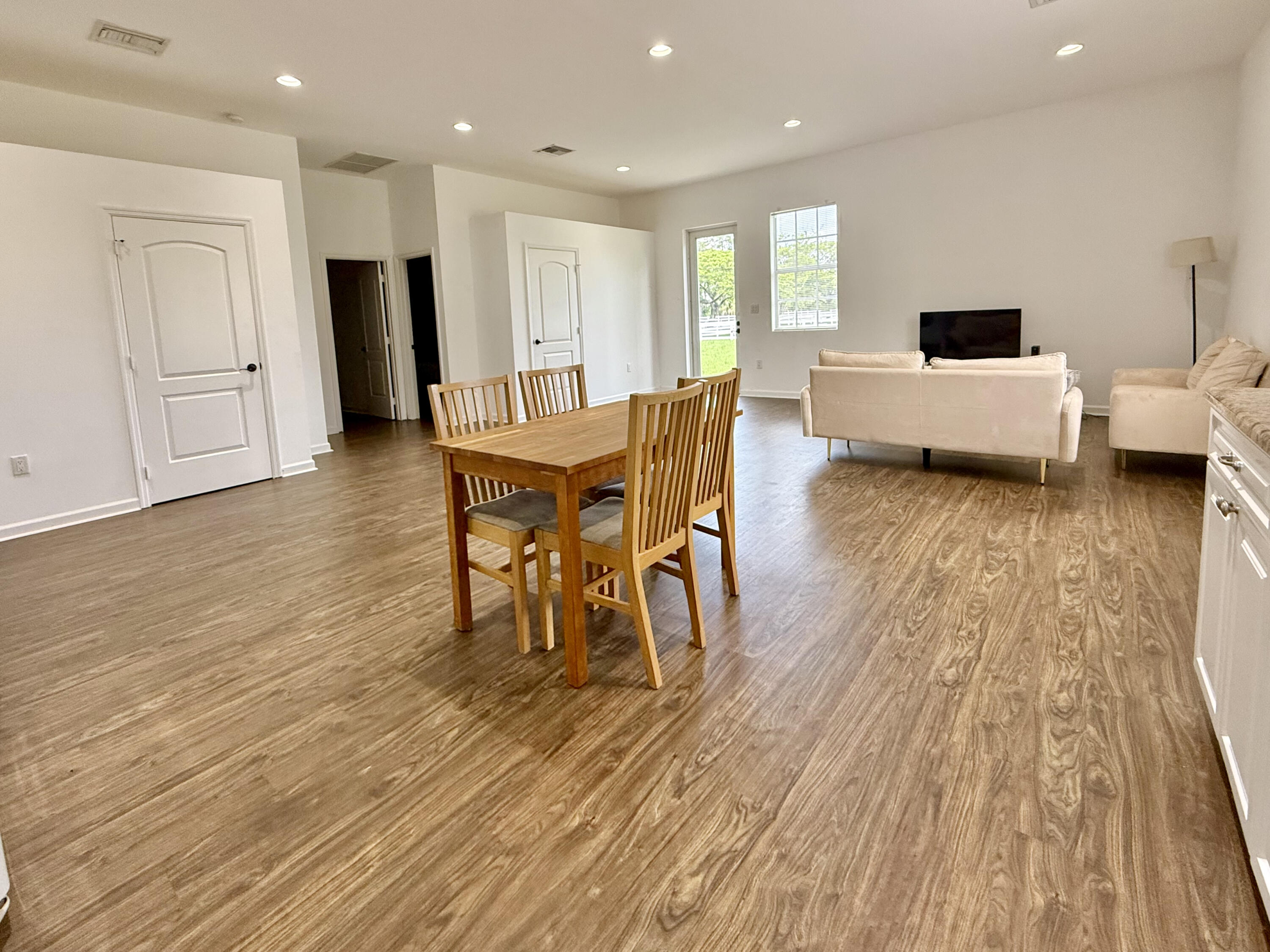 3935 Hanover Circle Loxahatchee, FL 33470 - Photo 16 of 29 a living room with furniture and a wooden floor