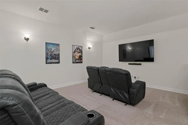 an empty room with closet and a chandelier fan