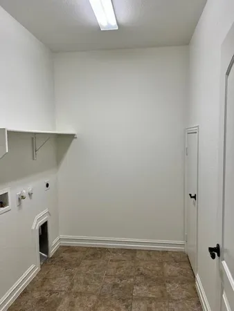 a bedroom with a bed and a bookshelf in it