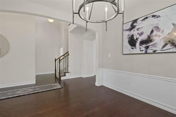 a view of a hallway with paintings on the wall