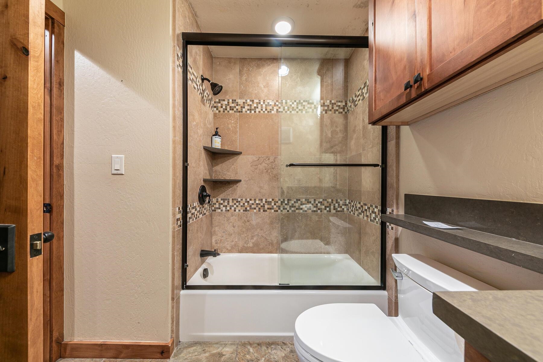 420 Shirley Cyn Road, Unit 34 Olympic Valley, CA 96146 - Photo 17 of 28 a bathroom with a shower and a toilet