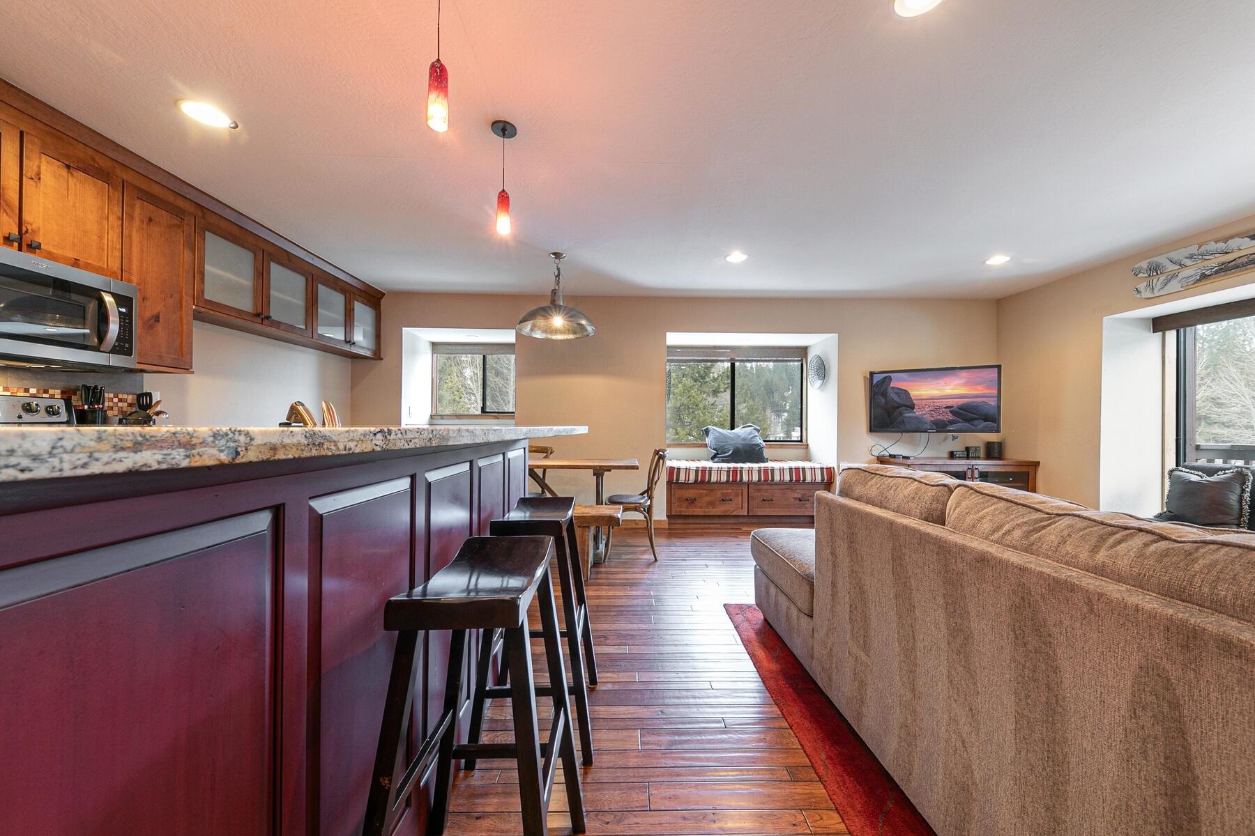 420 Shirley Cyn Road, Unit 34 Olympic Valley, CA 96146 - Photo 9 of 28 a living room with stainless steel appliances furniture a flat screen tv and a window
