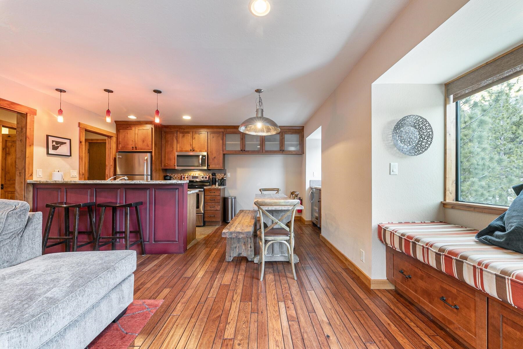 420 Shirley Cyn Road, Unit 34 Olympic Valley, CA 96146 - Photo 10 of 28 a view of a kitchen with kitchen island stainless steel appliances wooden floor dining table and chairs