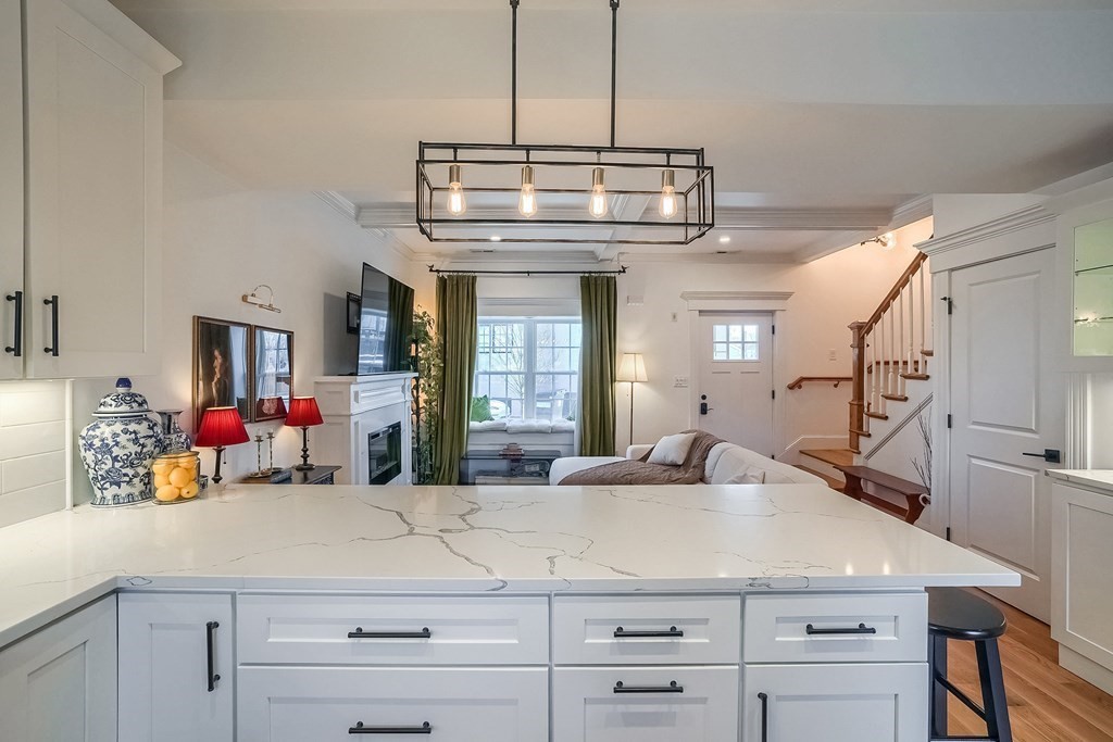 12 South Mason Street, Unit 3 Salem, MA 01970 - Photo 11 of 35 a kitchen with a sink and a refrigerator