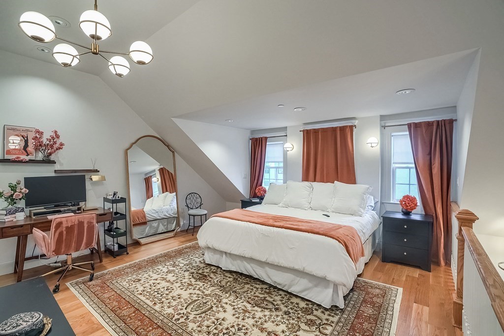 12 South Mason Street, Unit 3 Salem, MA 01970 - Photo 13 of 35 a bed room with a bed window and a television