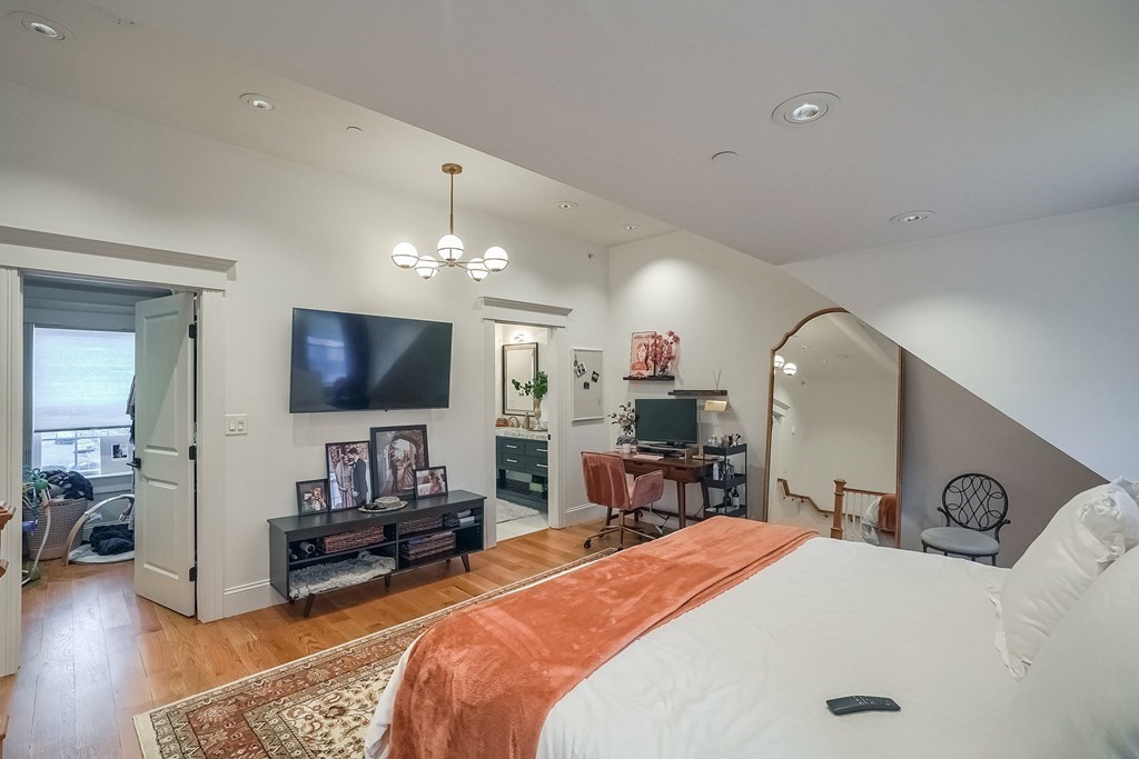 12 South Mason Street, Unit 3 Salem, MA 01970 - Photo 14 of 35 a bedroom with furniture and a flat screen tv