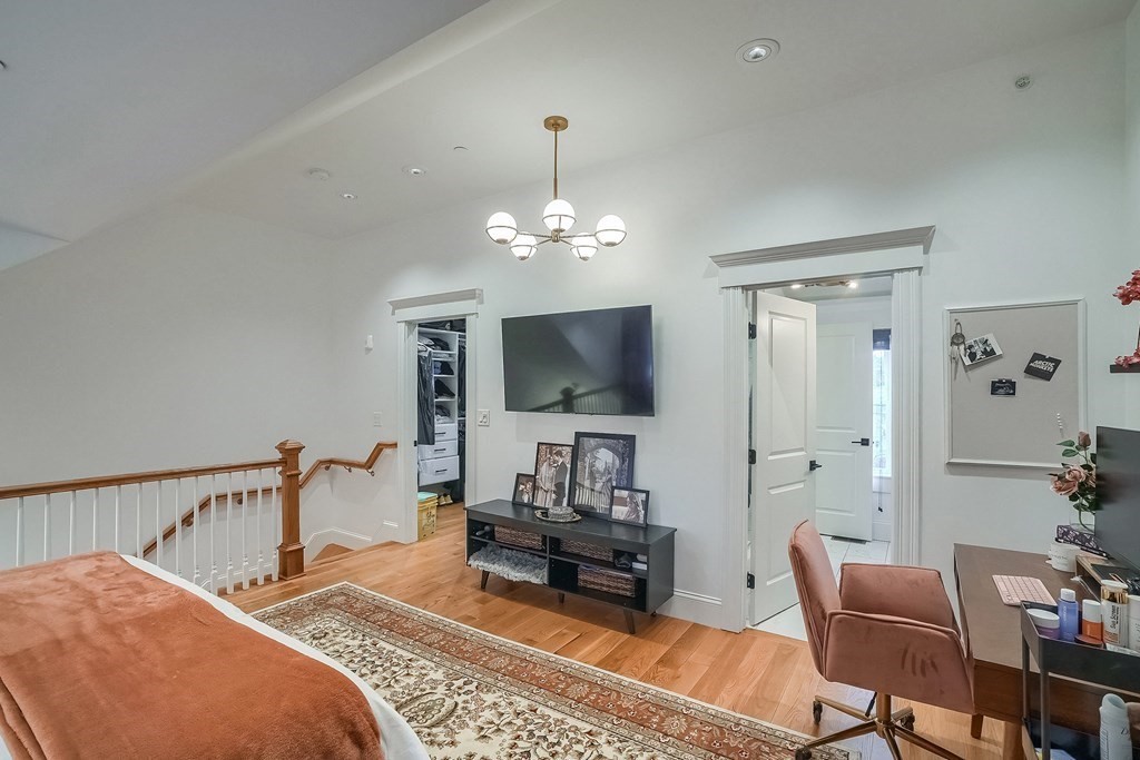 12 South Mason Street, Unit 3 Salem, MA 01970 - Photo 15 of 35 a bedroom with furniture and a flat screen tv