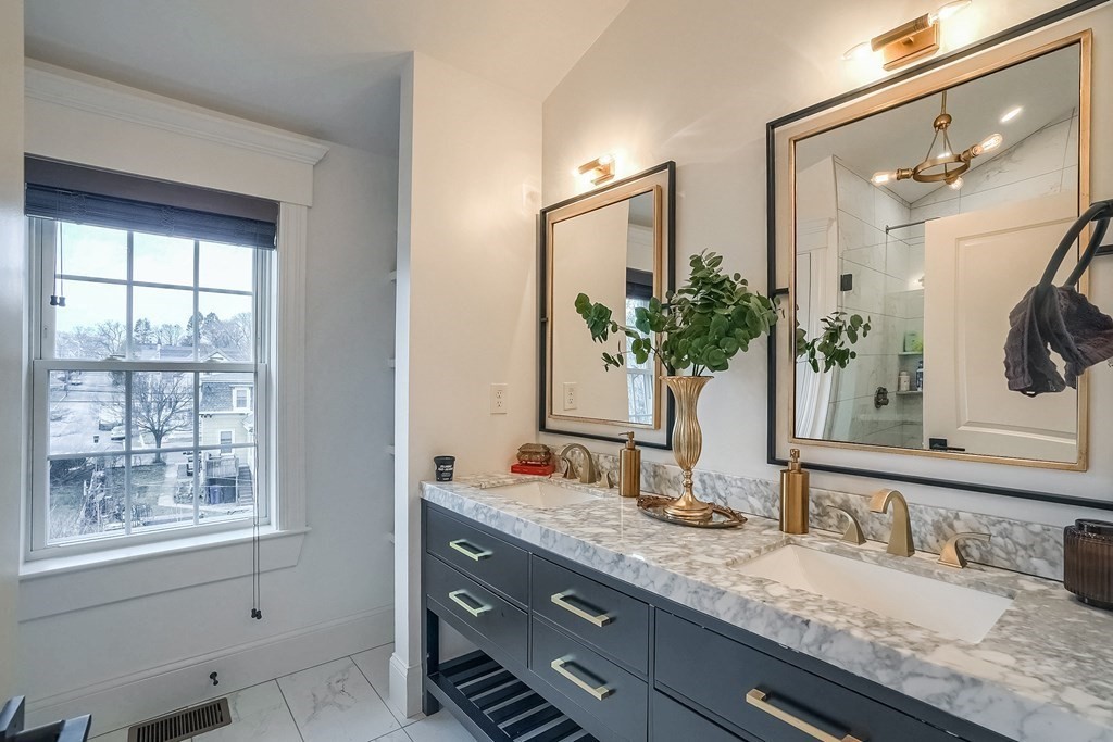 12 South Mason Street, Unit 3 Salem, MA 01970 - Photo 18 of 35 a bathroom with a granite countertop sink mirror and window
