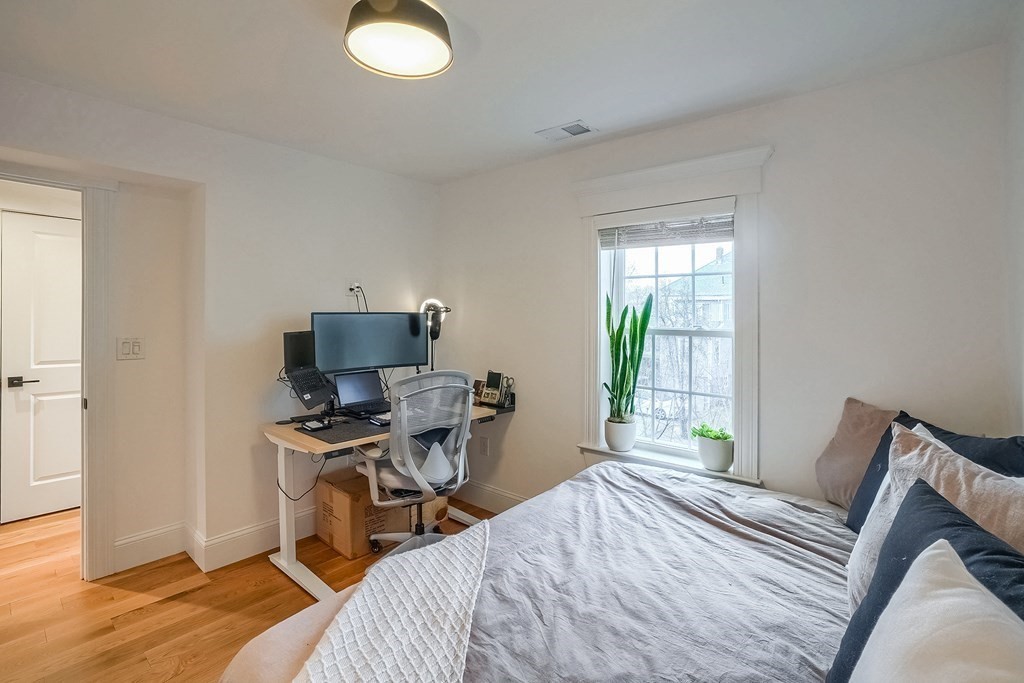 12 South Mason Street, Unit 3 Salem, MA 01970 - Photo 21 of 35 a bedroom with a bed and a window
