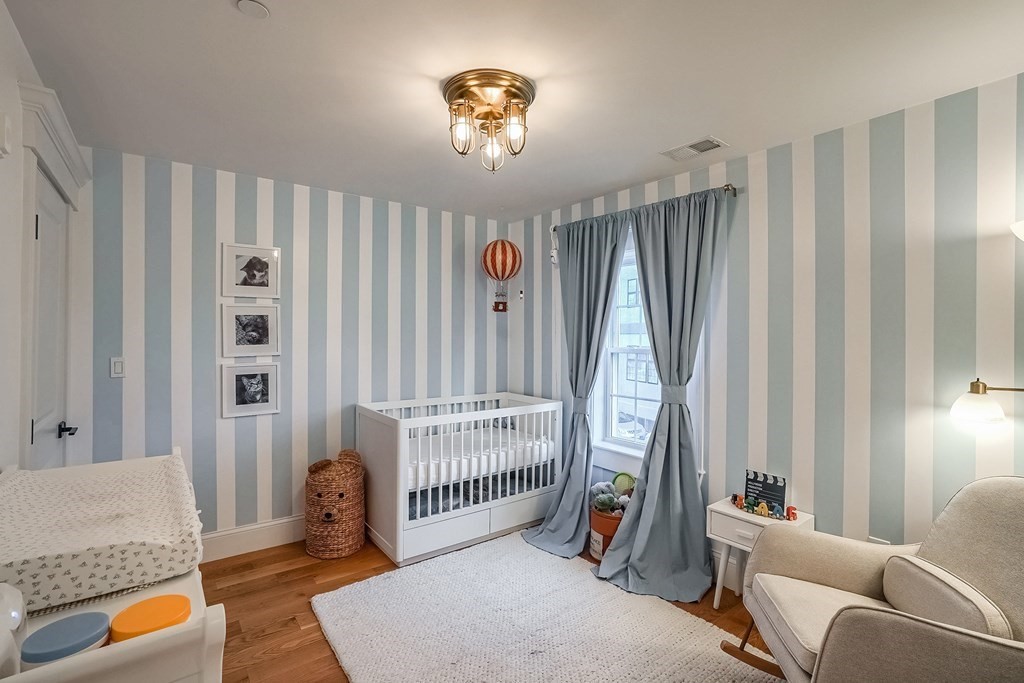 12 South Mason Street, Unit 3 Salem, MA 01970 - Photo 22 of 35 a bedroom with furniture and a large window