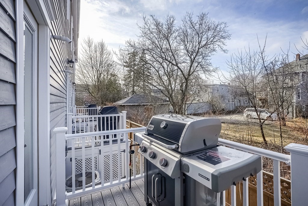 12 South Mason Street, Unit 3 Salem, MA 01970 - Photo 30 of 35 a view of roof deck with furniture and trees
