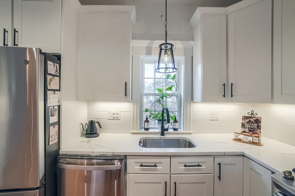 12 South Mason Street, Unit 3 Salem, MA 01970 - Photo 9 of 35 a kitchen with appliances cabinets and a window