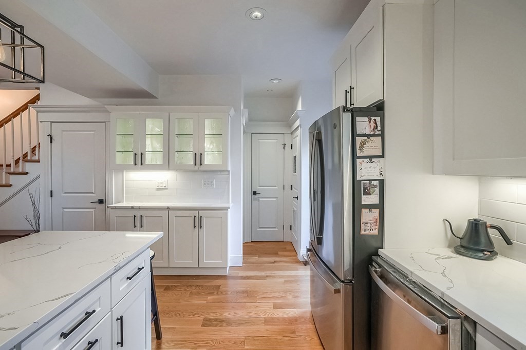 12 South Mason Street, Unit 3 Salem, MA 01970 - Photo 10 of 35 a kitchen with a refrigerator sink and stove