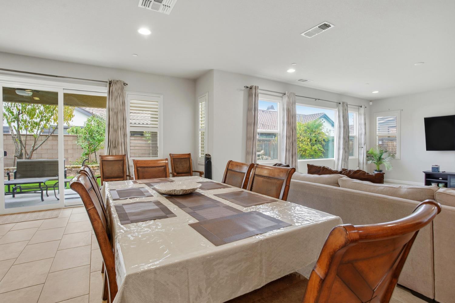 9729 Allen Ranch Way Elk Grove, CA 95757 - Photo 11 of 36 a view of a dining room with furniture window and outside view