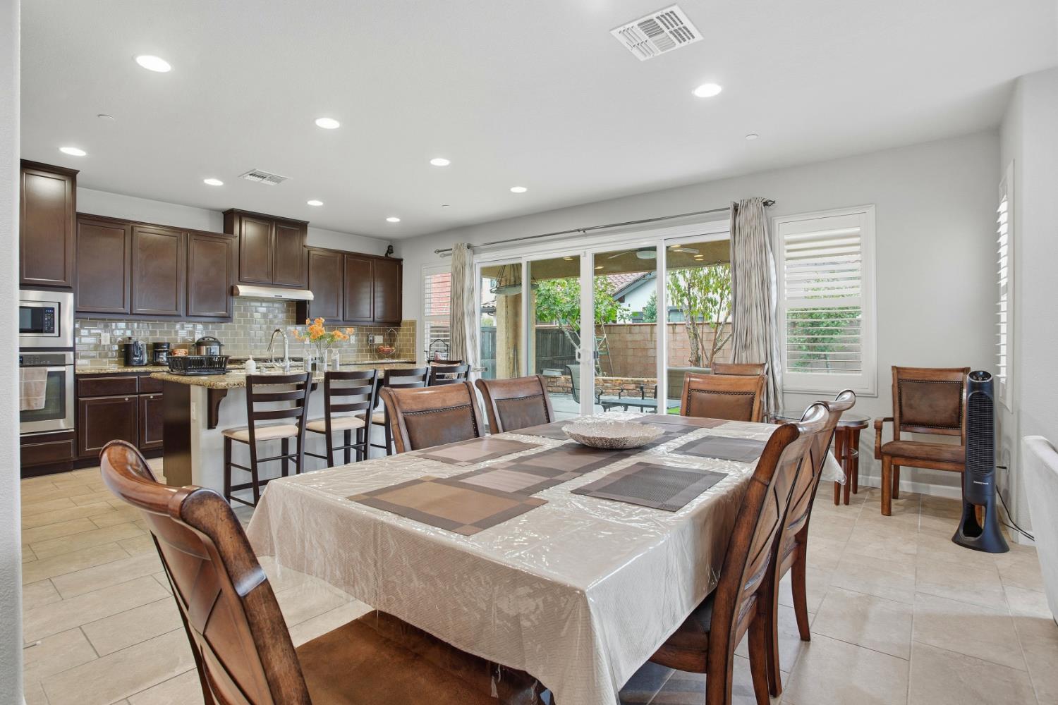 9729 Allen Ranch Way Elk Grove, CA 95757 - Photo 12 of 36 a view of a dining room with furniture window and outside view