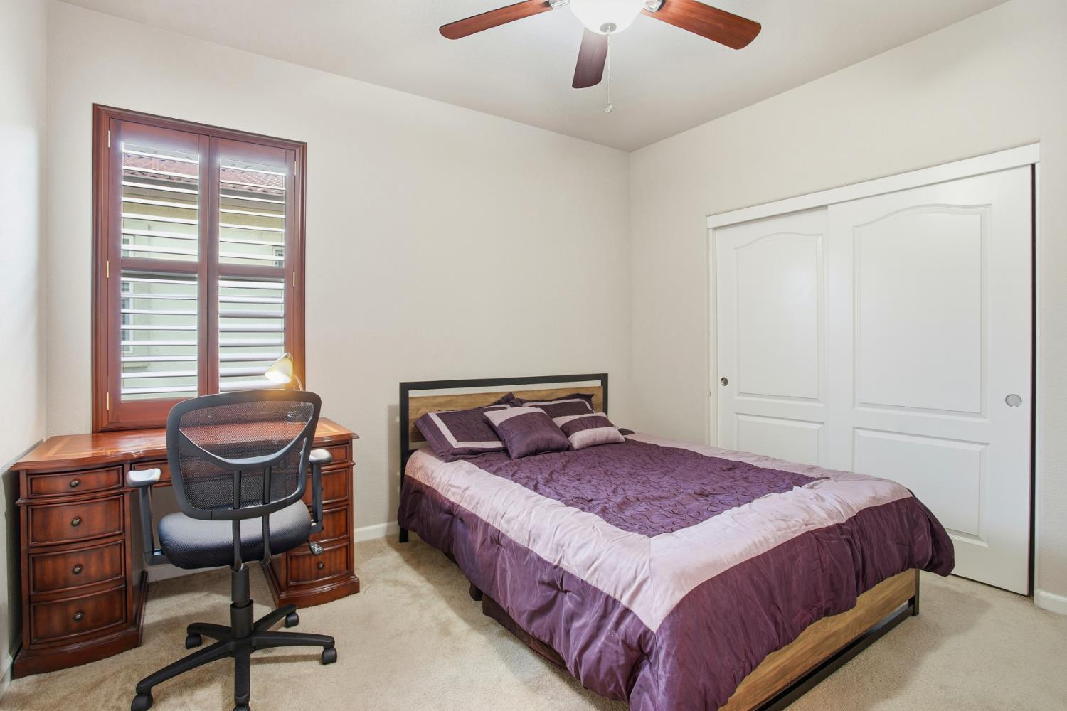 9729 Allen Ranch Way Elk Grove, CA 95757 - Photo 19 of 36 a bedroom with a bed and a chandelier