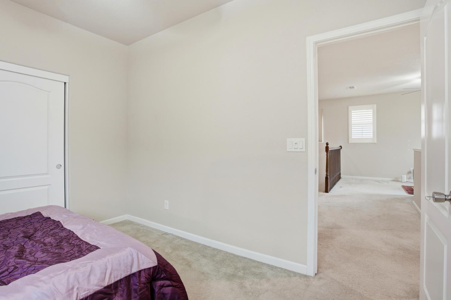 9729 Allen Ranch Way Elk Grove, CA 95757 - Photo 21 of 36 a bedroom with a bed and hallway