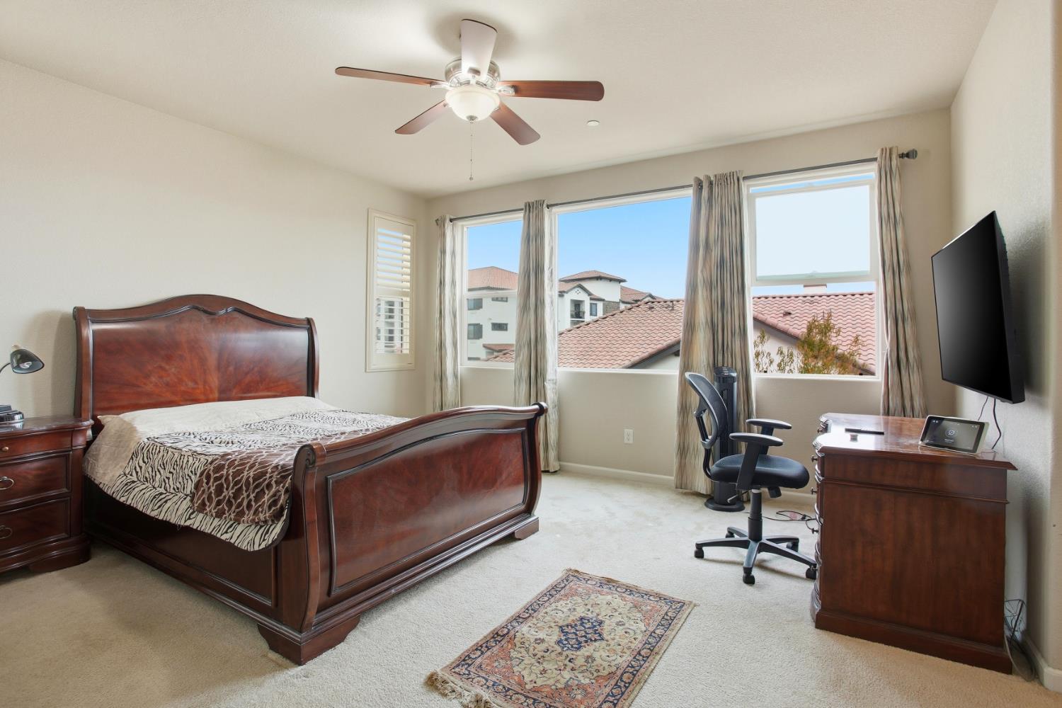 9729 Allen Ranch Way Elk Grove, CA 95757 - Photo 23 of 36 a bedroom with a bed and a flat screen tv