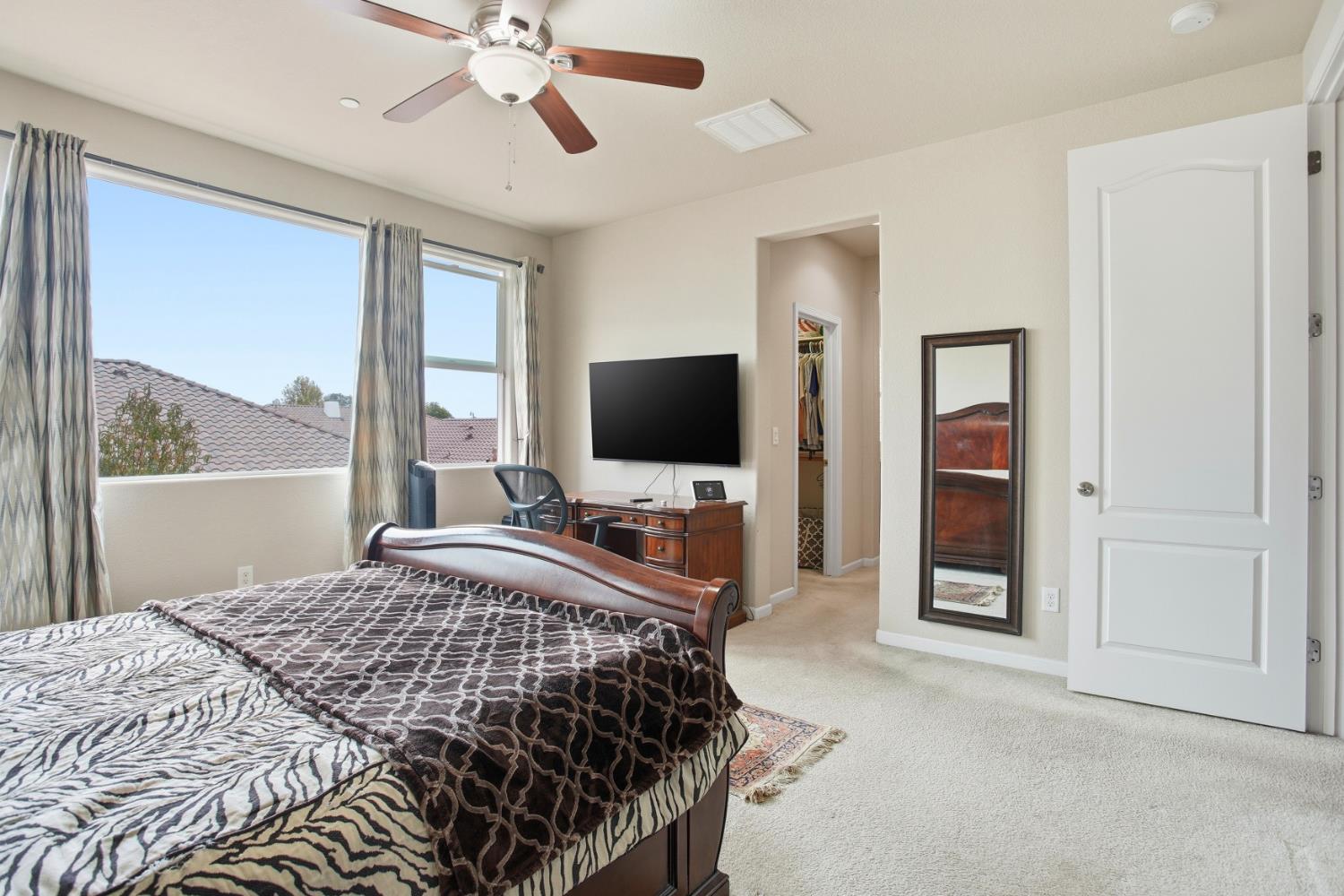 9729 Allen Ranch Way Elk Grove, CA 95757 - Photo 24 of 36 a bedroom with a bed and a flat screen tv