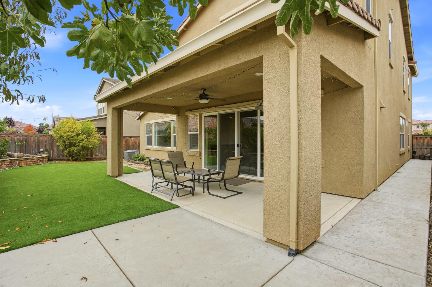 9729 Allen Ranch Way Elk Grove, CA 95757 - Photo 31 of 36 a view of a house with backyard sitting area and garden