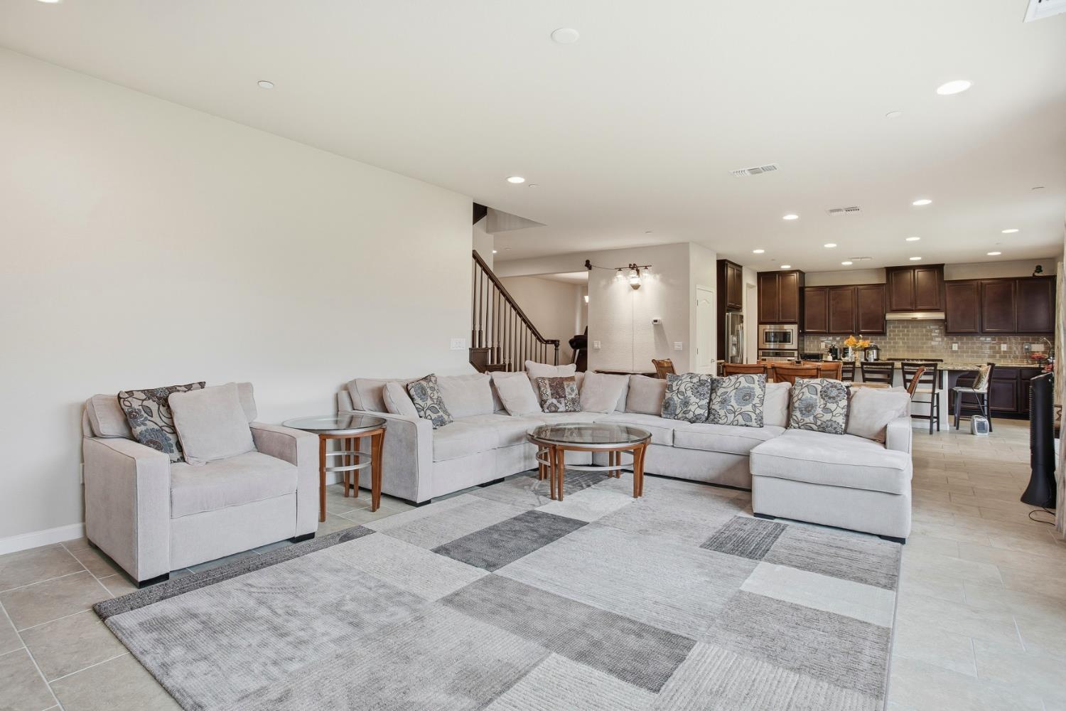 9729 Allen Ranch Way Elk Grove, CA 95757 - Photo 4 of 36 a living room with furniture and view of kitchen