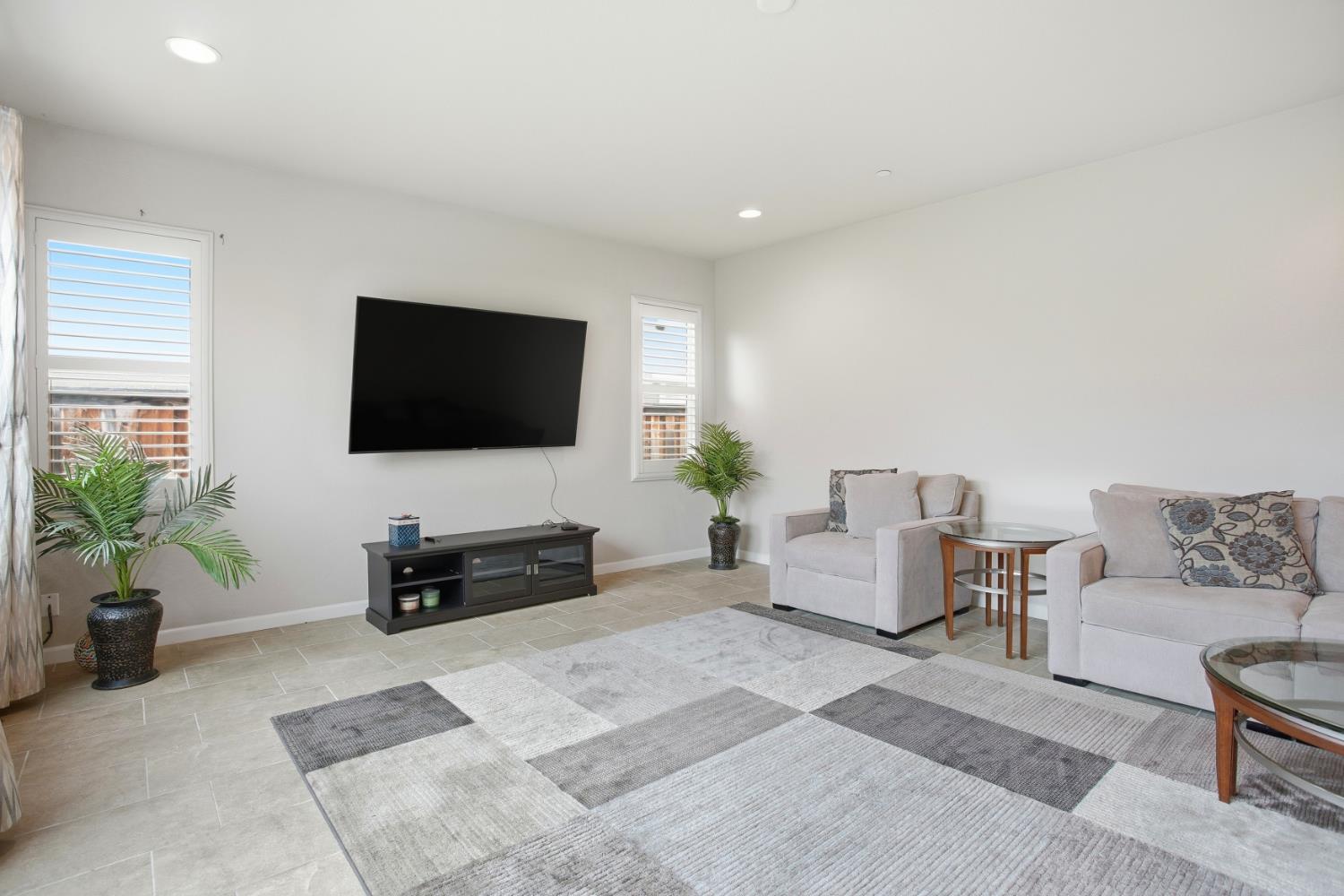 9729 Allen Ranch Way Elk Grove, CA 95757 - Photo 5 of 36 a living room with furniture and a flat screen tv