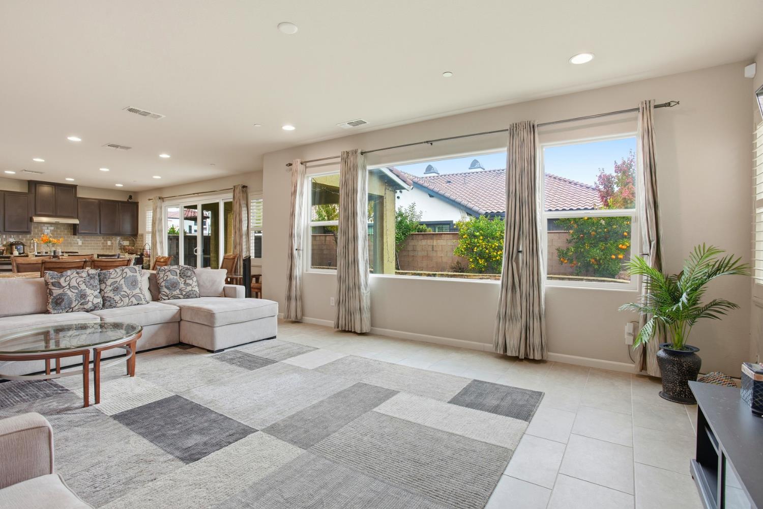 9729 Allen Ranch Way Elk Grove, CA 95757 - Photo 6 of 36 a living room with furniture and a large window