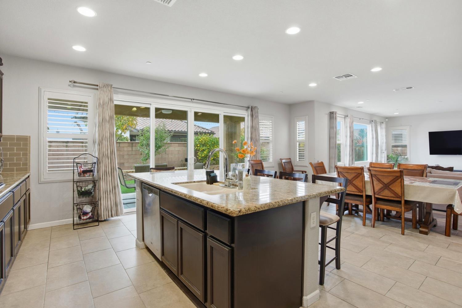 9729 Allen Ranch Way Elk Grove, CA 95757 - Photo 9 of 36 a kitchen with appliances cabinets and dining table