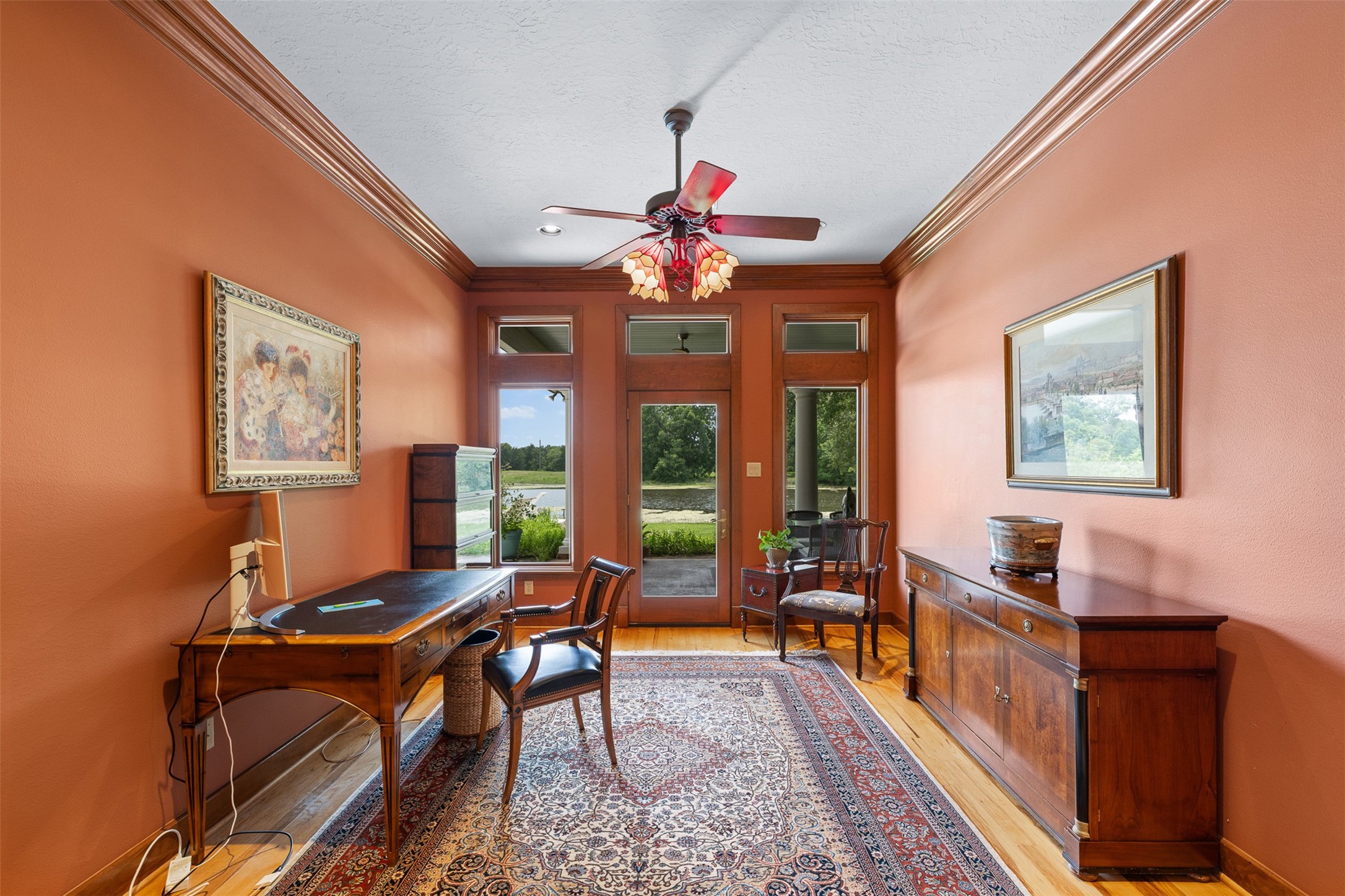 8502 Stansberry Road Wallis, TX 77485 - Photo 22 of 50 Study with warm, earthy tones and large windows that offer a picturesque view of the outdoors, and patio access.