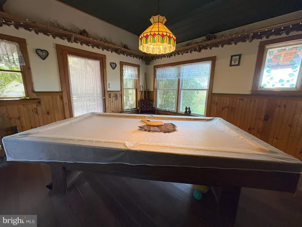 a large kitchen with stainless steel appliances kitchen island granite countertop a sink and cabinets