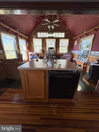 a stove top oven sitting inside of a kitchen