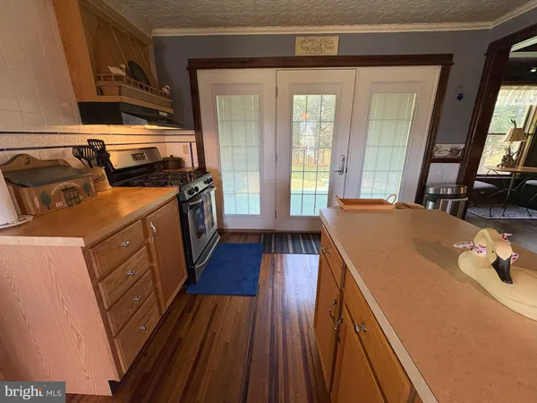 a view of kitchen and dining room with wooden floor