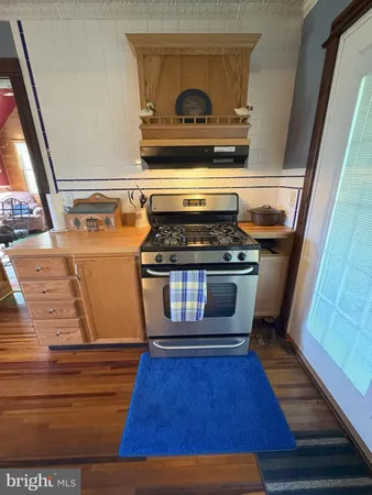 a kitchen with cabinets a sink and appliances