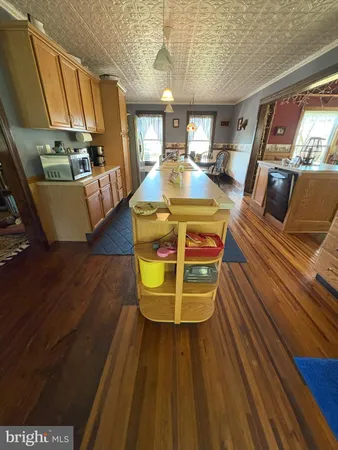 a dining room with furniture and a floor to ceiling window