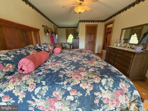 a view of a field with trees in the background