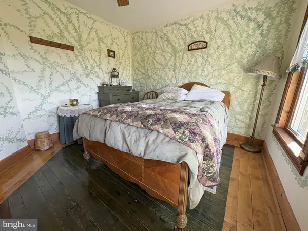 a view of a big yard with a house in the background