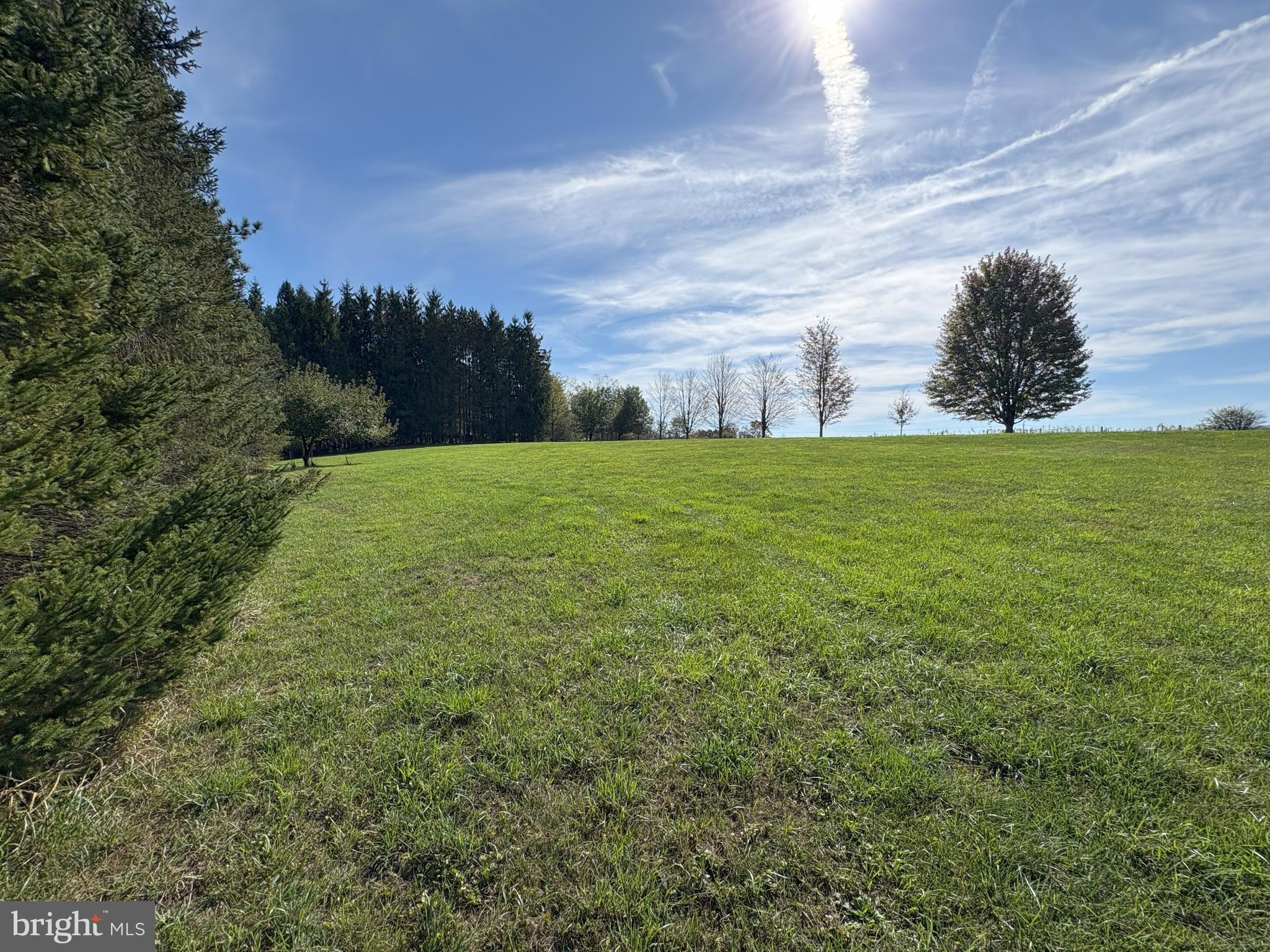 43 Songbird Way Galeton, PA 16922 - Photo 67 of 73 a view of a big yard with a house in the background