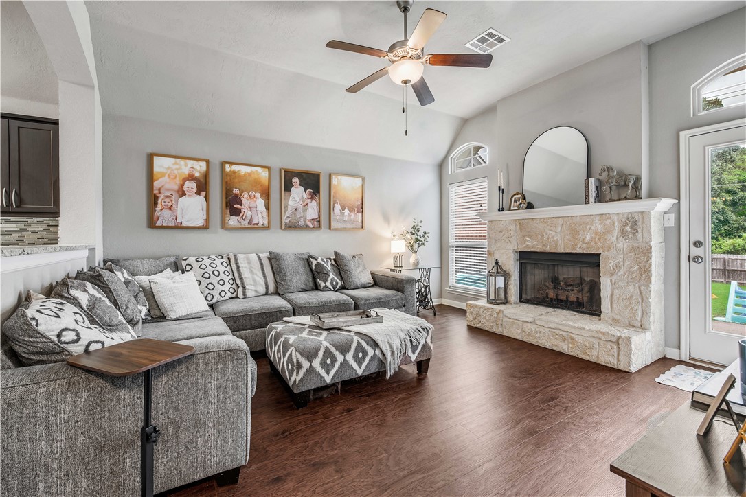 3014 Positano Loop Bryan, TX 77808 - Photo 9 of 23 a living room with furniture fireplace and wooden floor