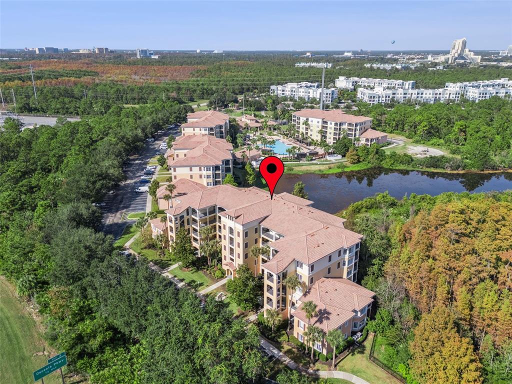8801 Worldquest Boulevard, Unit 4108 Orlando, FL 32821 - Photo 33 of 85 an aerial view of residential houses with outdoor space and river