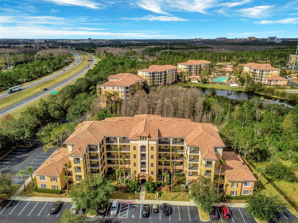 8801 Worldquest Boulevard, Unit 4108 Orlando, FL 32821 - Photo 42 of 85 a view of a lake with a city view