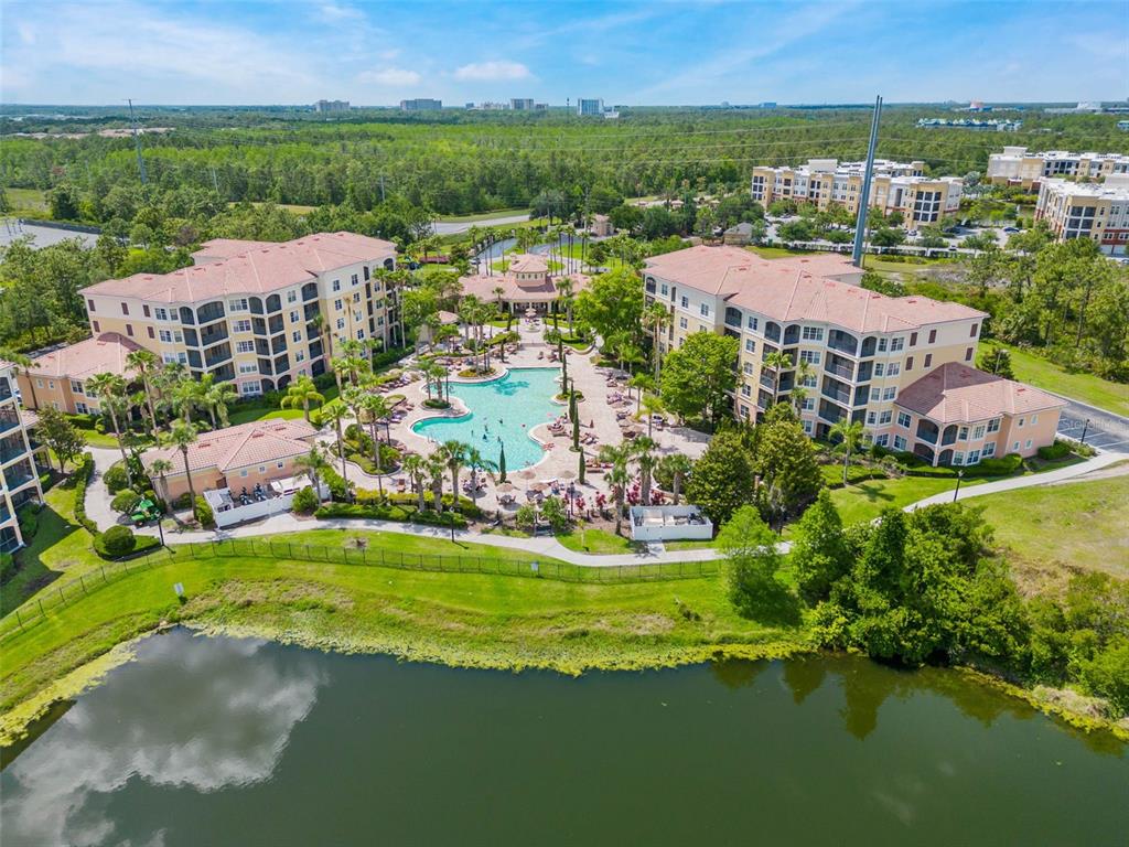 8801 Worldquest Boulevard, Unit 4108 Orlando, FL 32821 - Photo 55 of 85 an aerial view of residential houses with outdoor space and lake view