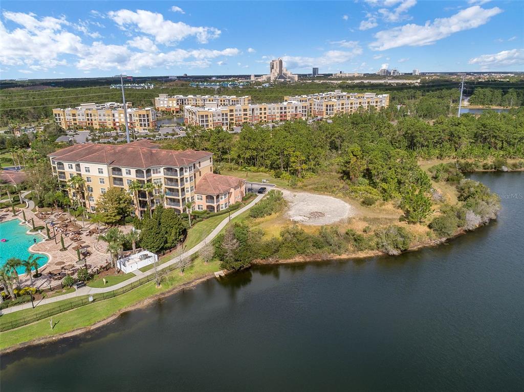 8801 Worldquest Boulevard, Unit 4108 Orlando, FL 32821 - Photo 79 of 85 a view of a lake with a houses