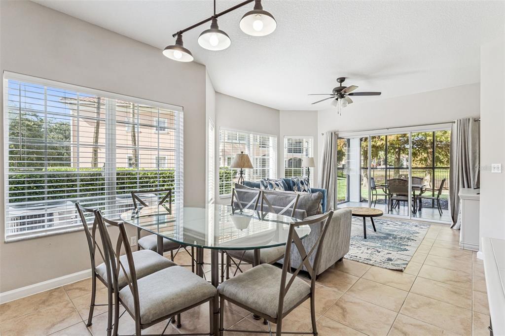 8801 Worldquest Boulevard, Unit 4108 Orlando, FL 32821 - Photo 10 of 85 a view of a dining room with furniture window and outside view