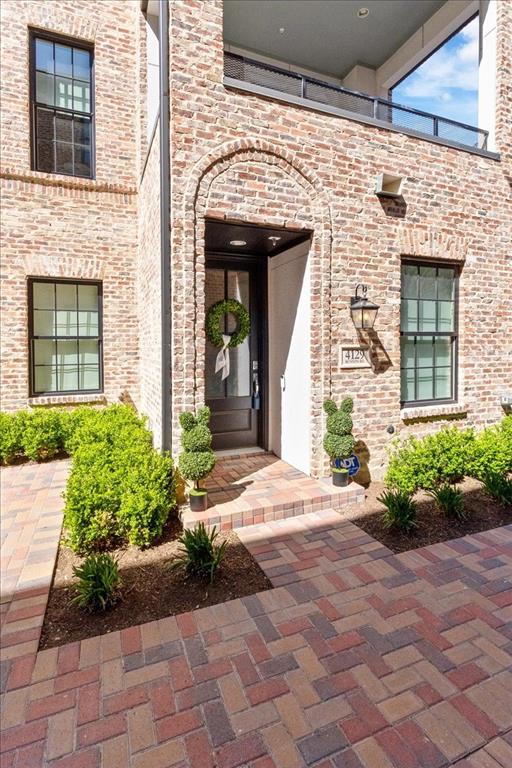 Entrance to property with brick siding